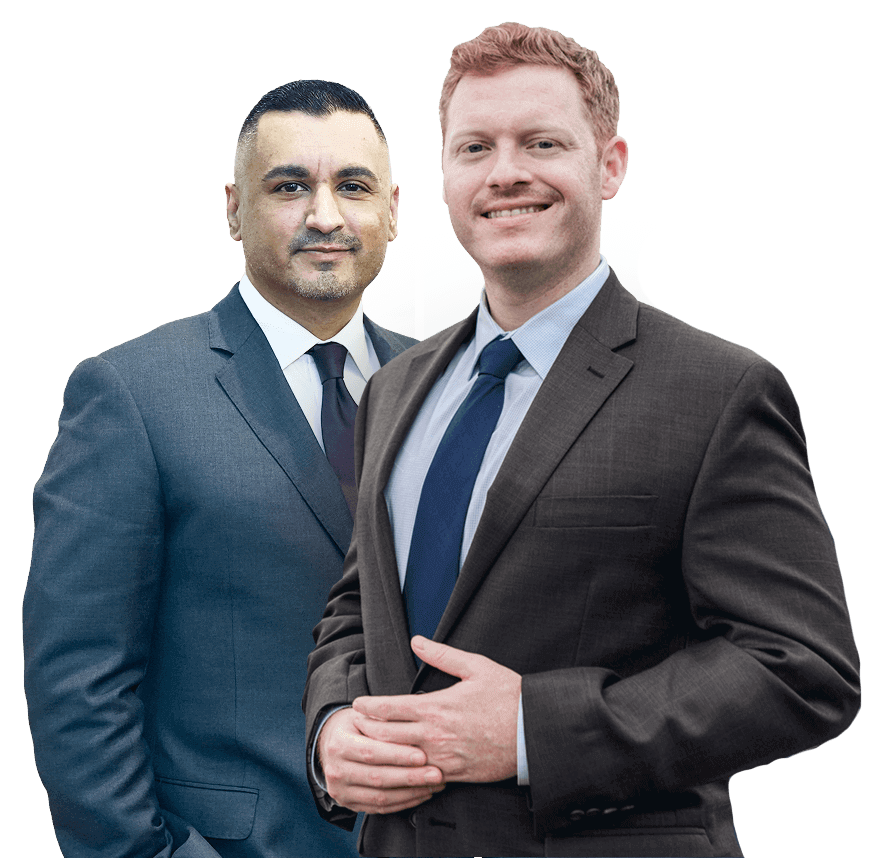 Two men in suits smiling confidently, symbolizing professional success and teamwork.