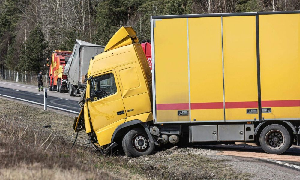 a yellow truck that is sitting on the side of the road