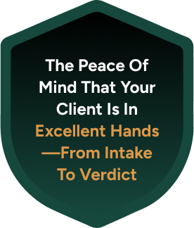Shield-shaped badge with text The peace of mind that your client is in excellent hands from intake to verdict