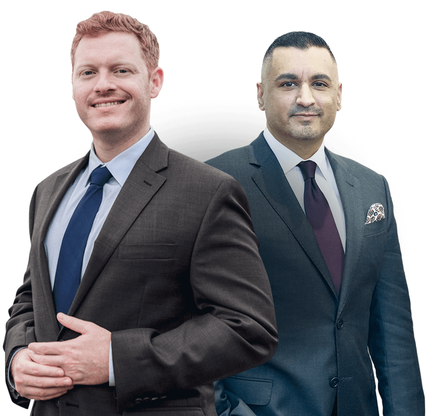 Two confident businessmen in suits, smiling, showcasing professional success and teamwork.