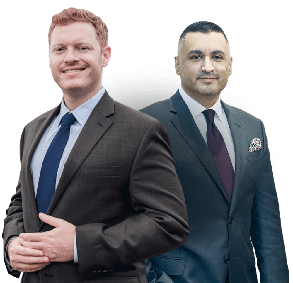 Two confident businessmen in suits, smiling, showcasing professional success and teamwork.
